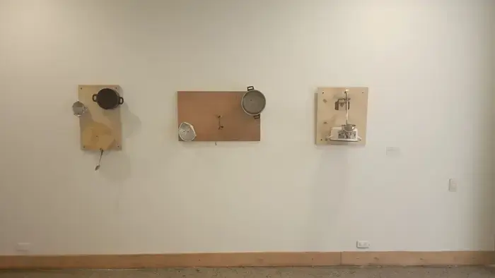 Close-up of gears and metallic structures in the Protest Machines installation